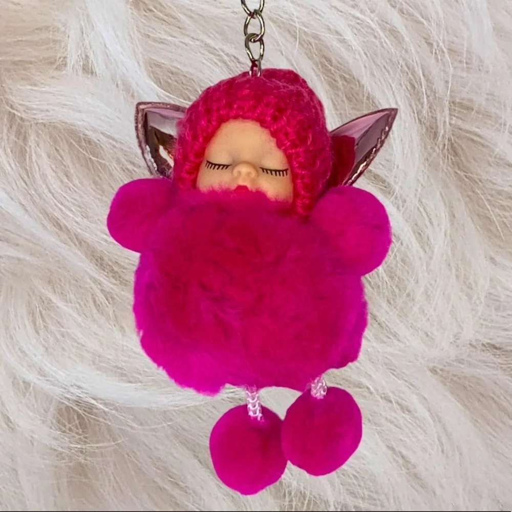 SLEEPY BABY WITH FAIRY WINGS SMALL POMPON IN FUCHSIA KEYCHAIN CHARM‎